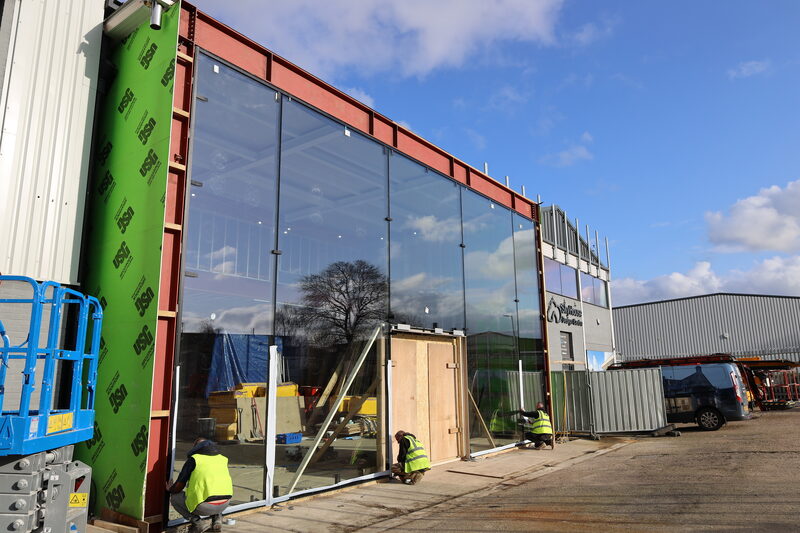 Sky House renovation - oversized glass fa&Atilde;&sect;ade under construction