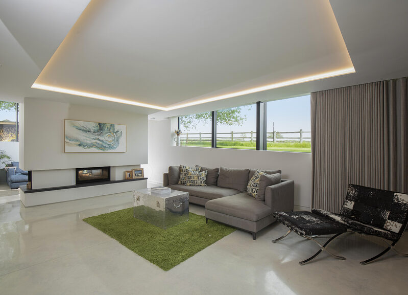 Living room with recessed curtain tracks