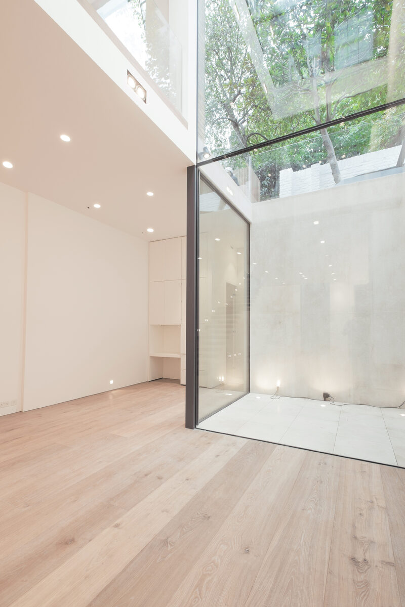 Maximizing natural light in their basement by incorporating an internal courtyard
