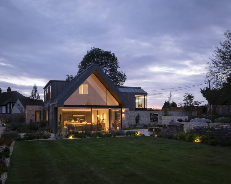 Gable end glazing in contemporary new build, shot at dusk