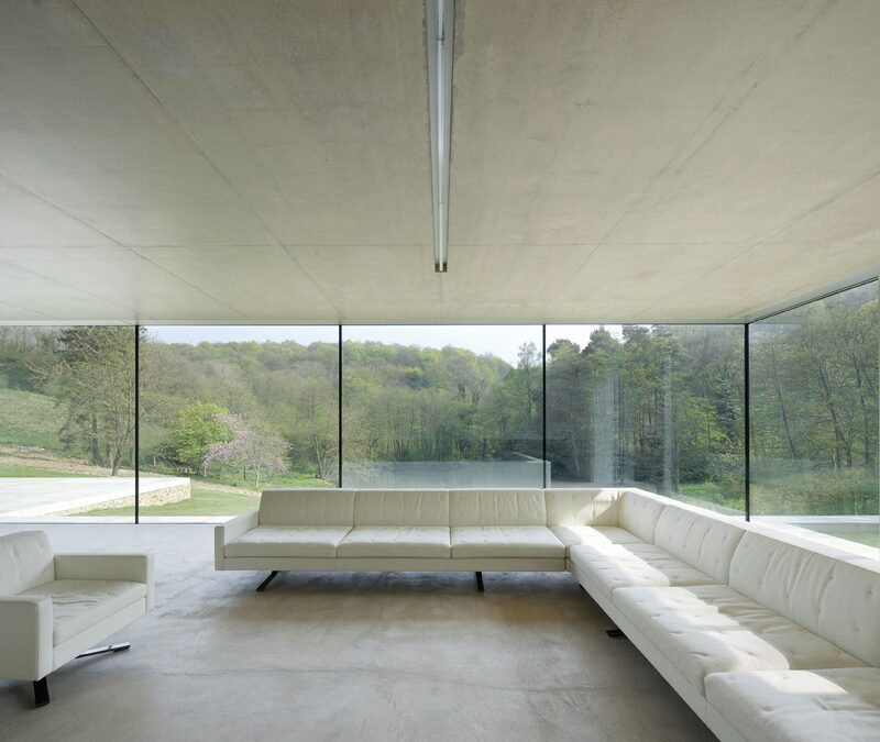 Frameless glass walls with neat silicone joins between the large panes