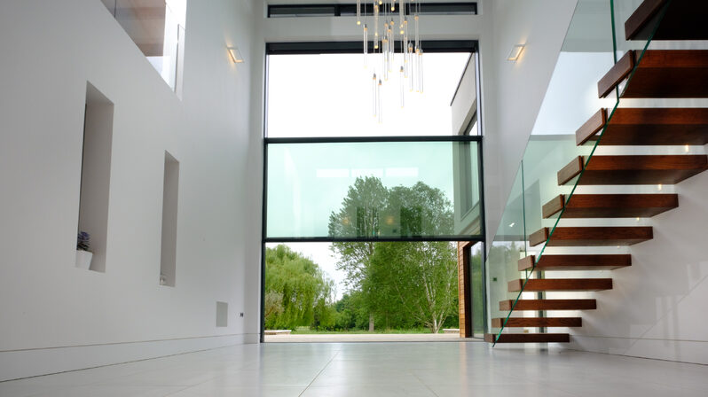 A double height vertical sash window delivers the wow factor to this luxury new build in Henley.