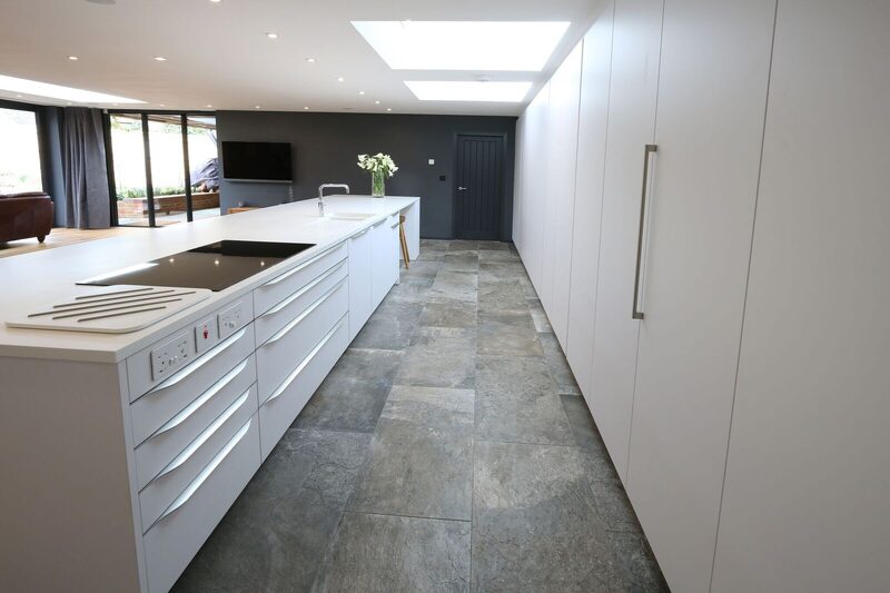 Monochrome kitchen design with open plan lounge area