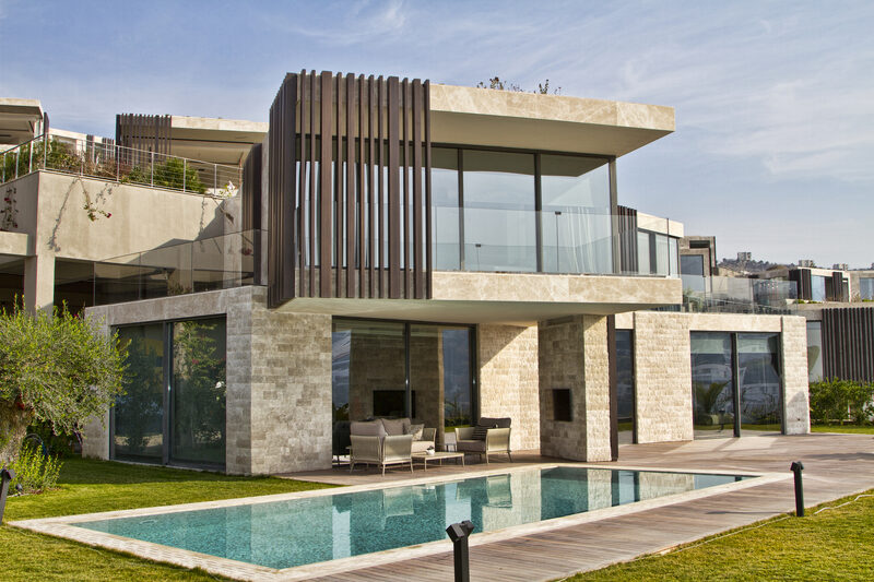 Contemporary exterior design, featuring frameless glass balustrades and timber cladding