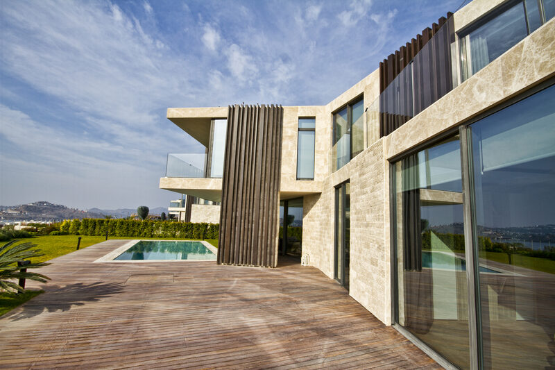 Large indoor outdoor living area with swimming pool