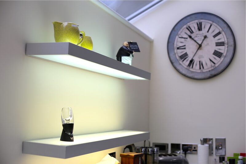 Under shelf lighting in white kitchen design