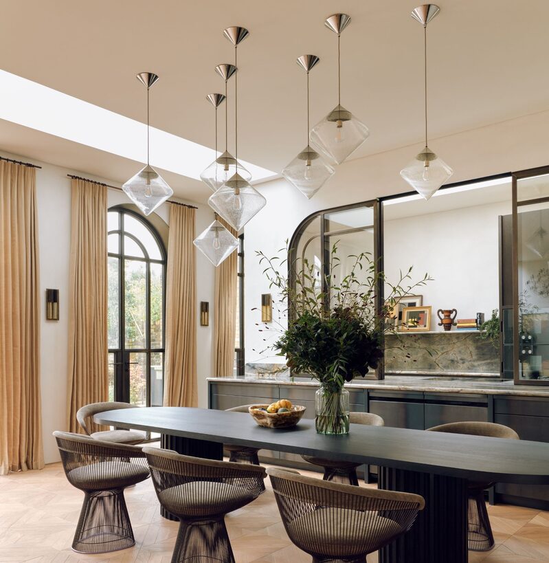 Brass arched sliding window to kitchen at Kew Green