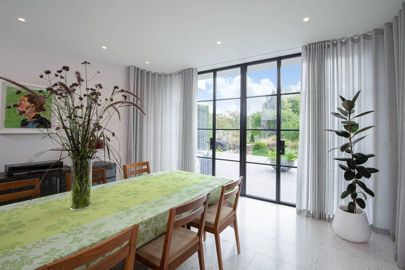 Mondrian steel framed doors and discreet shading to luxury Wimbledon home.