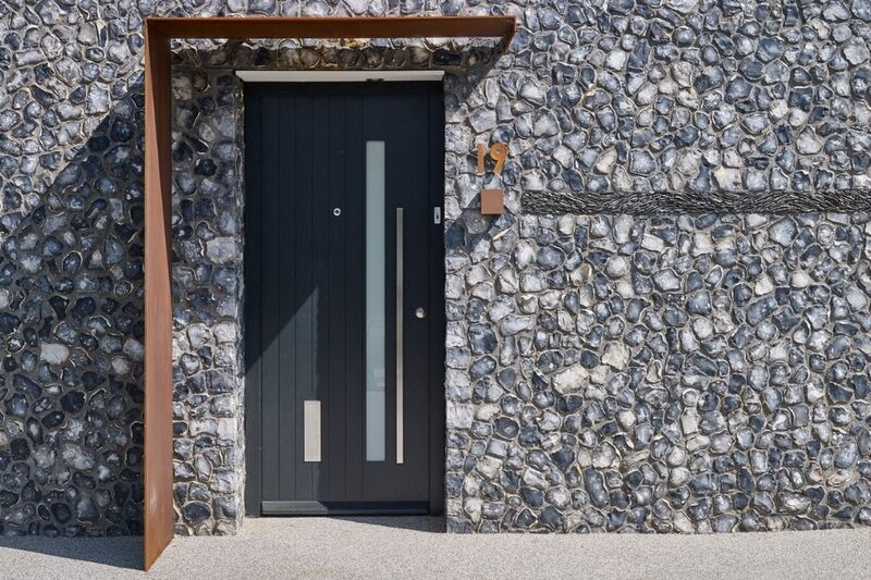 black entrance door with single glass pane