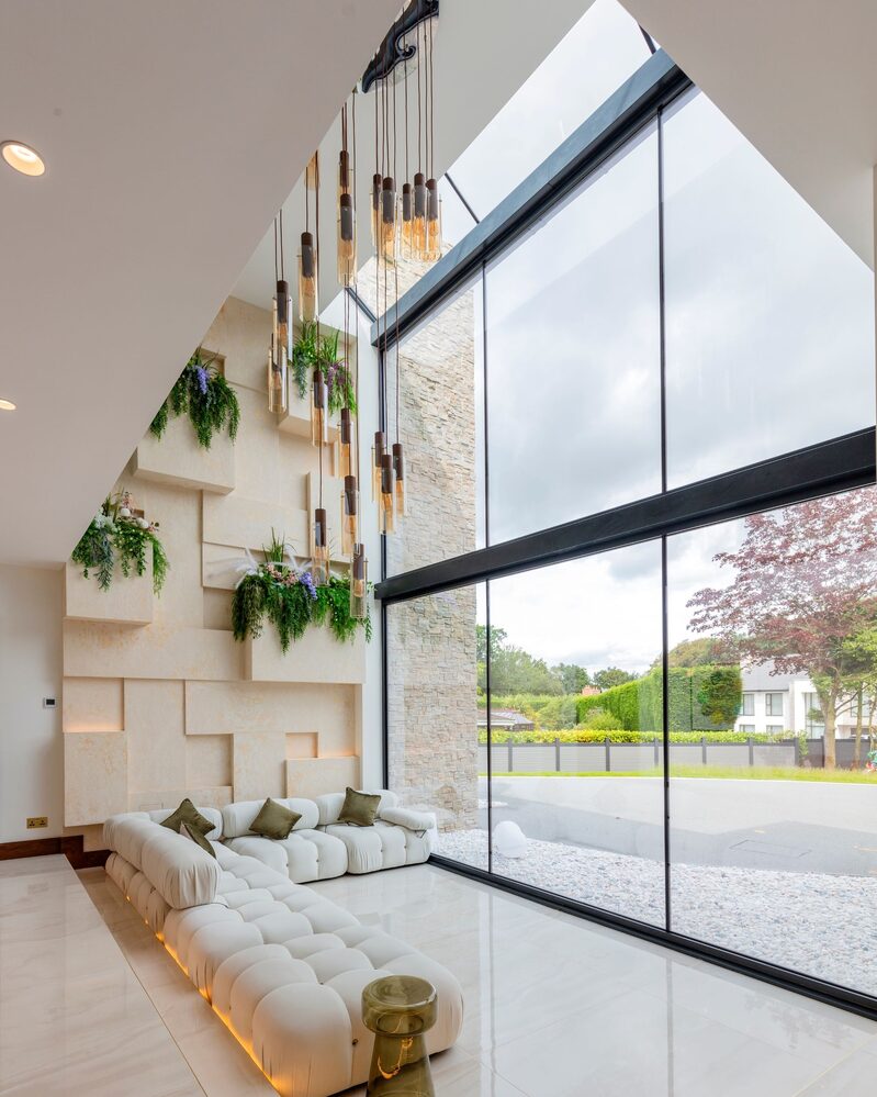 Structural glass to luxury home creates a dramatic light filled atrium