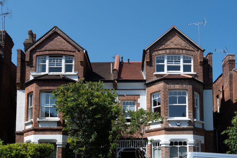 Timber window systems on traditional home exterior