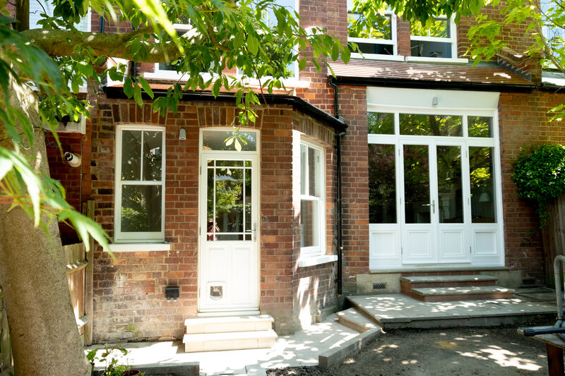 Rear fa&Atilde;&sect;ade with timber window and door systems providing garden access