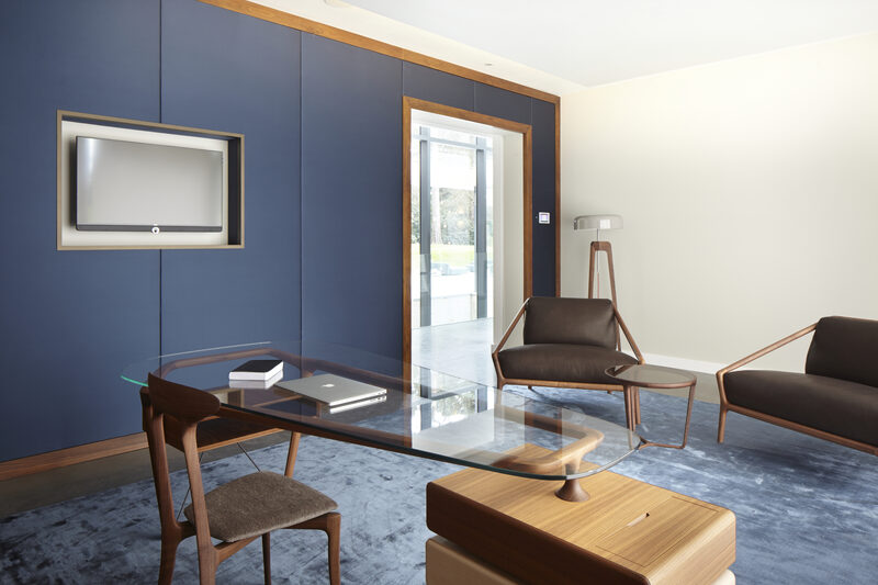 Home office utilising natural materials such as wood and leather to create professional environment