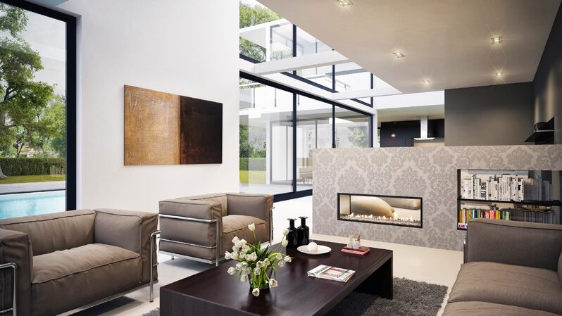 Broken plan living room with glass fireplace and minimally framed glazing