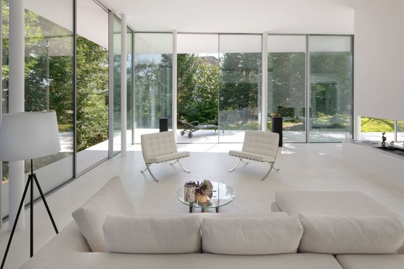 floor to ceiling sliding glass doors in a minimalist living room