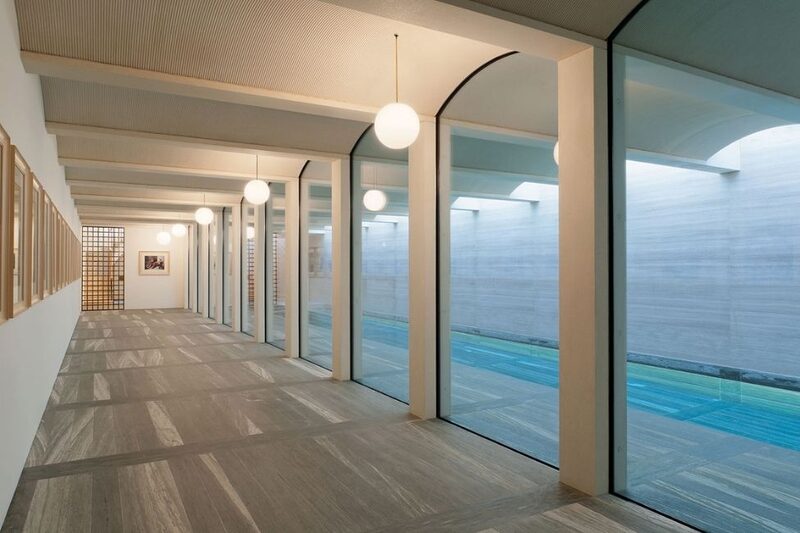 arches with frameless heated glass and a pool view