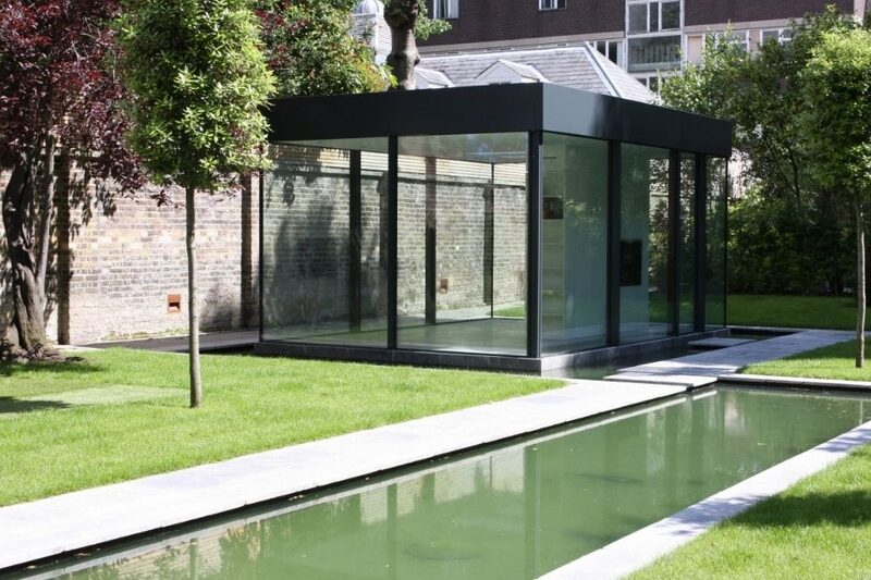 glass garden room with wrap around glazing