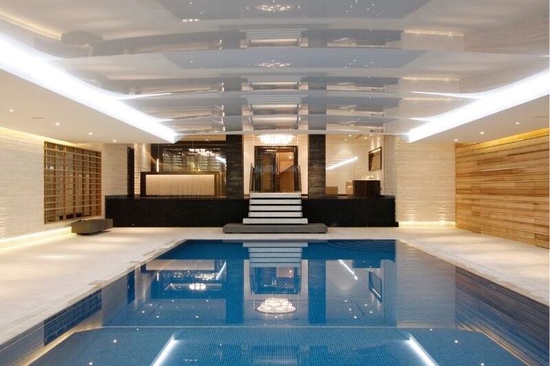 Swimming Pool & Spa Area Separated By Frameless Glass Walls