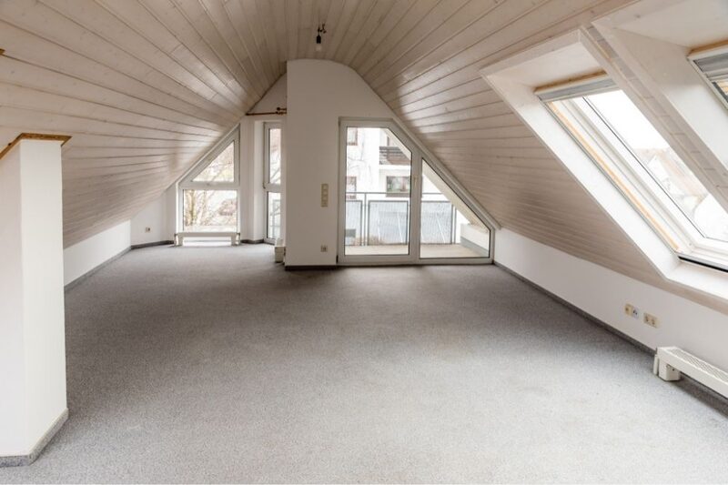 loft conversion with a balcony and neutral interior