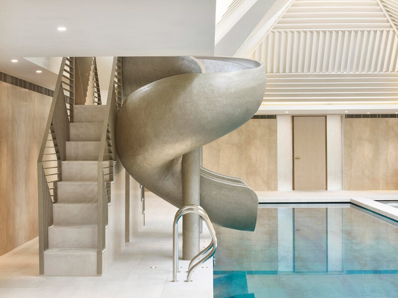A statuesque slide to pool in luxury house