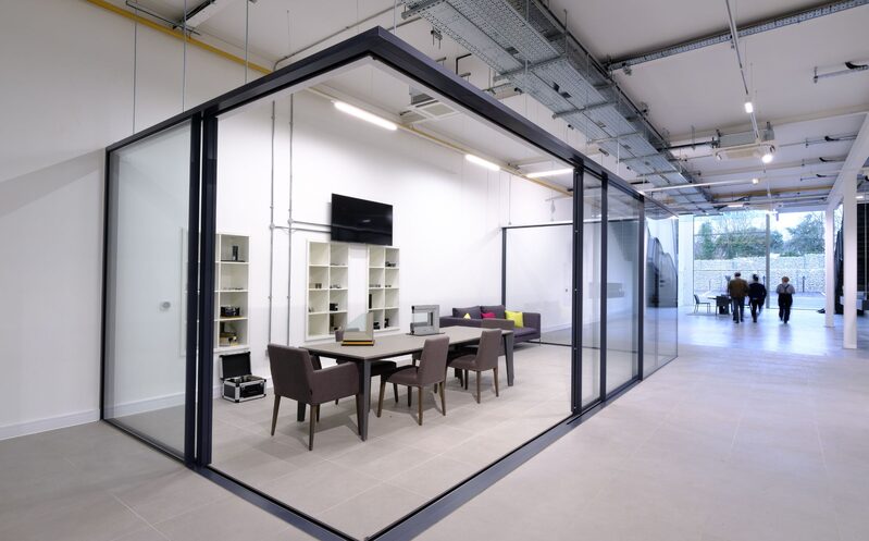 Ultra slim framed sliding glass doors and windows in an open corner configuration