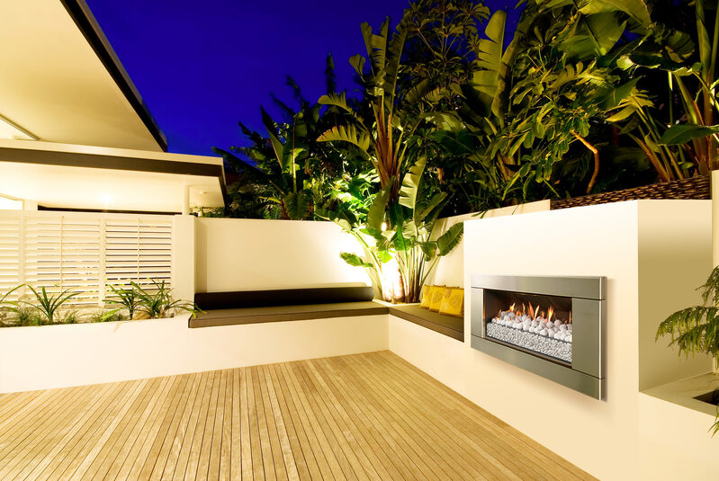 rooftop garden with natural wood decking and built in fireplace