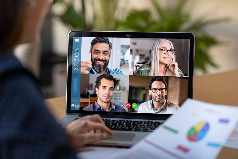 Video conference meeting on laptop screen