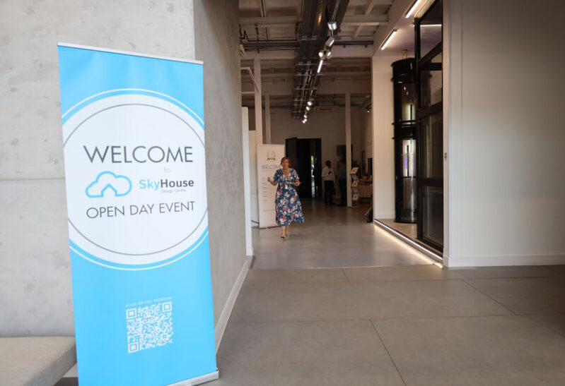 interior design showroom open day with banner scannable QR code