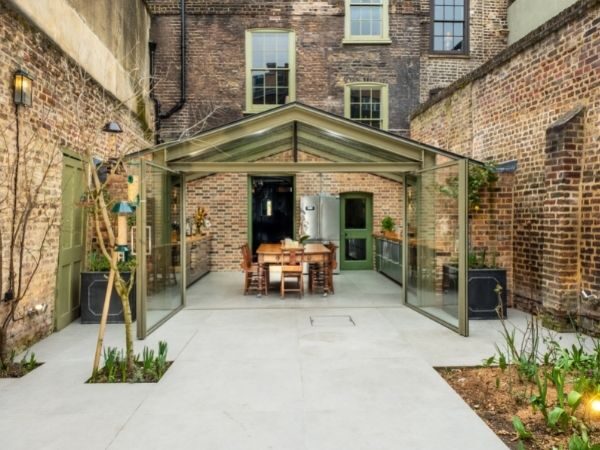steel look home extension with double opening pivot doors