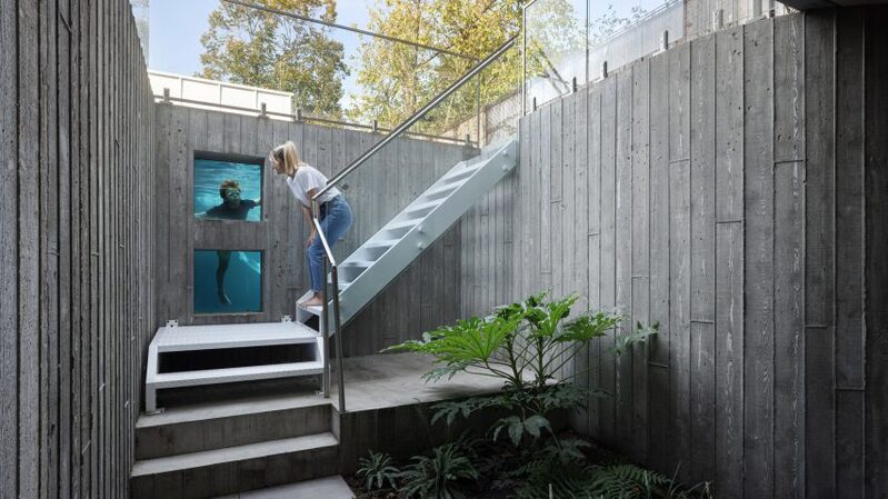 Underwater pool slide house with glass window