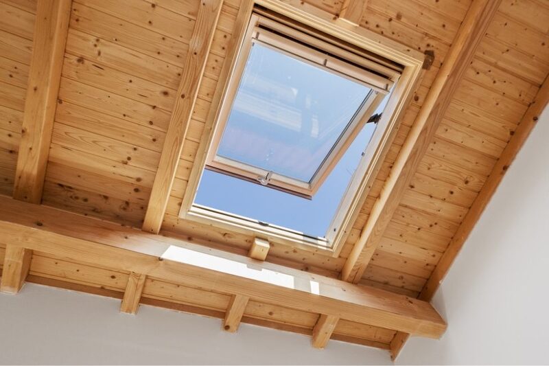loft conversion with a wooden roof and window